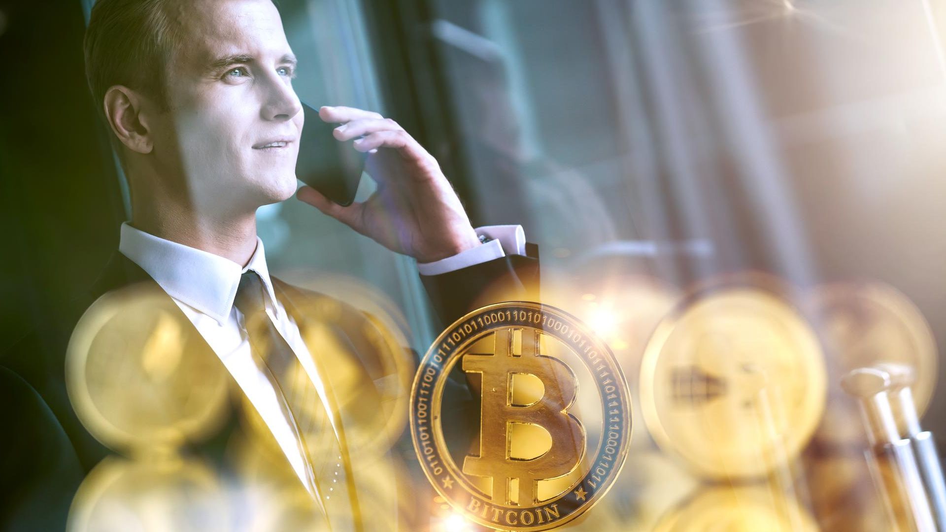 Homem de negocios ao telefone com bitcoins